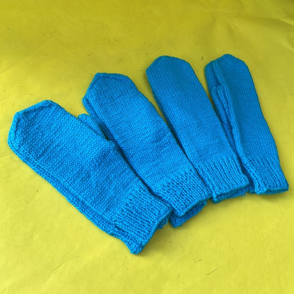 New turquoise hand knitted wool mittens